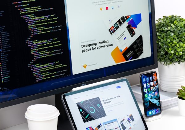 Laptop, tablet and phone displaying a website design on a desk, representing the Boutique Retail Storefront project